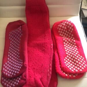 3 pairs of non skid slipper socks. Two low never worn one longer pair